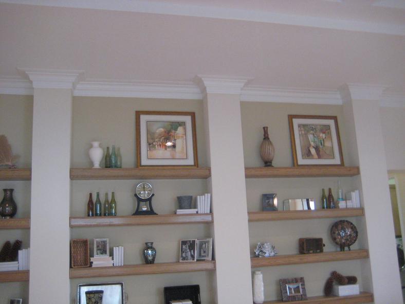 Built-in display niches with custom shelving and trim