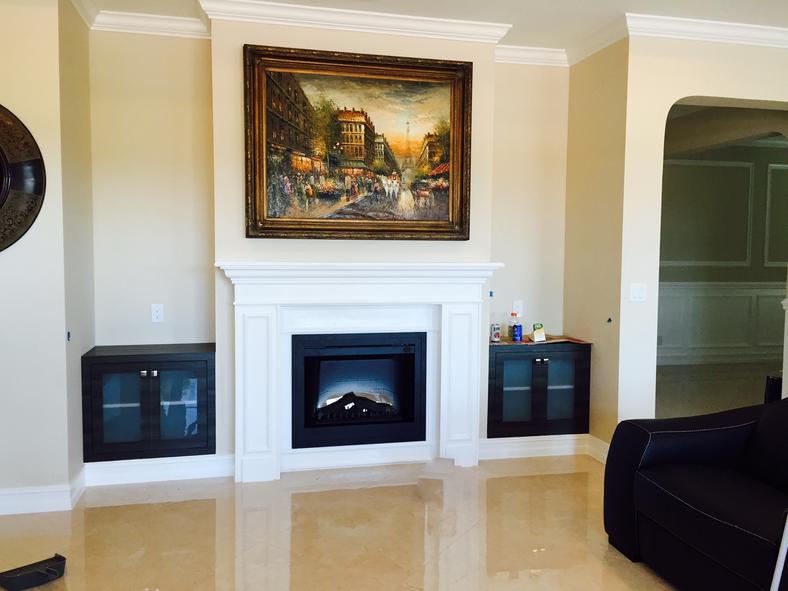 Custom white fireplace mantel with decorative molding